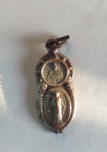 A beautiful charm pendant buried for almost 80 years from the Pacific War